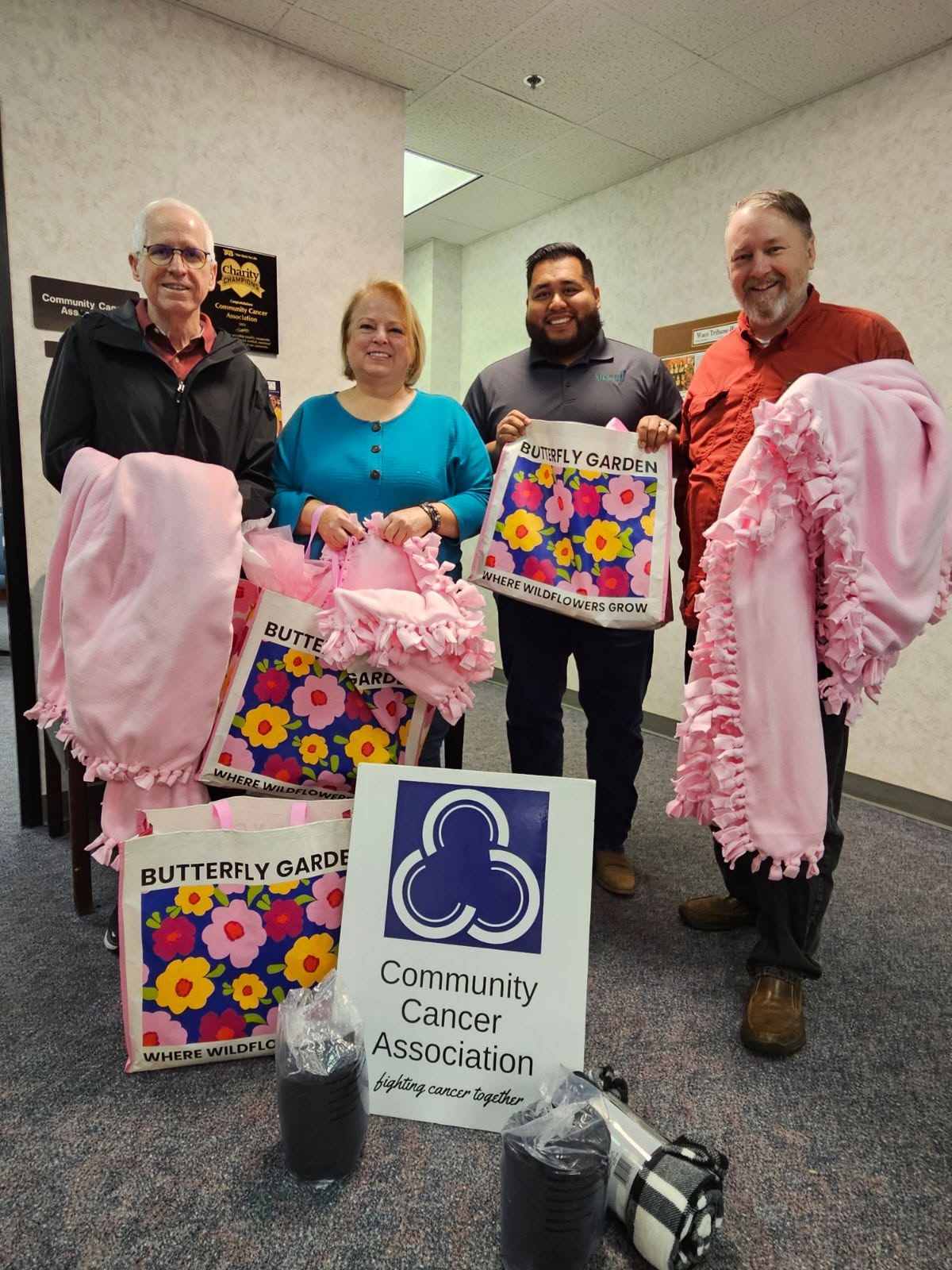 CCA board members with donated blankets and care items for cancer patients
